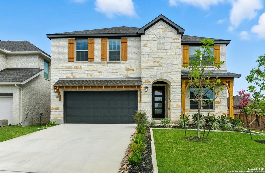 Front exterior of a new home in Legacy at Lake Dunlap, New Braunfels, TX, highlighting curb appeal (Image 18).