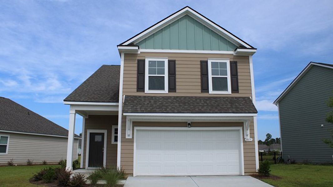 Front exterior of a new home in Auberon Woods, Conway, SC, highlighting curb appeal (Image 1).