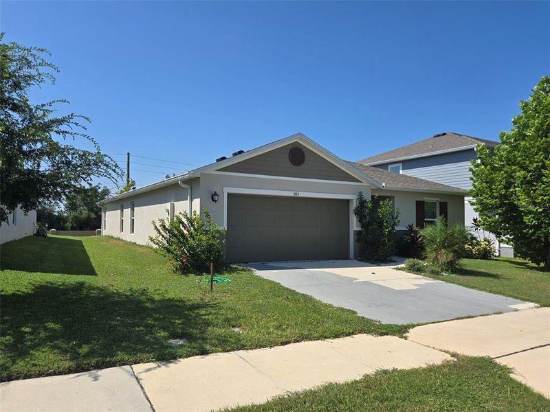 Front exterior of a new home in , Winter Haven, FL, highlighting curb appeal (Image 18).