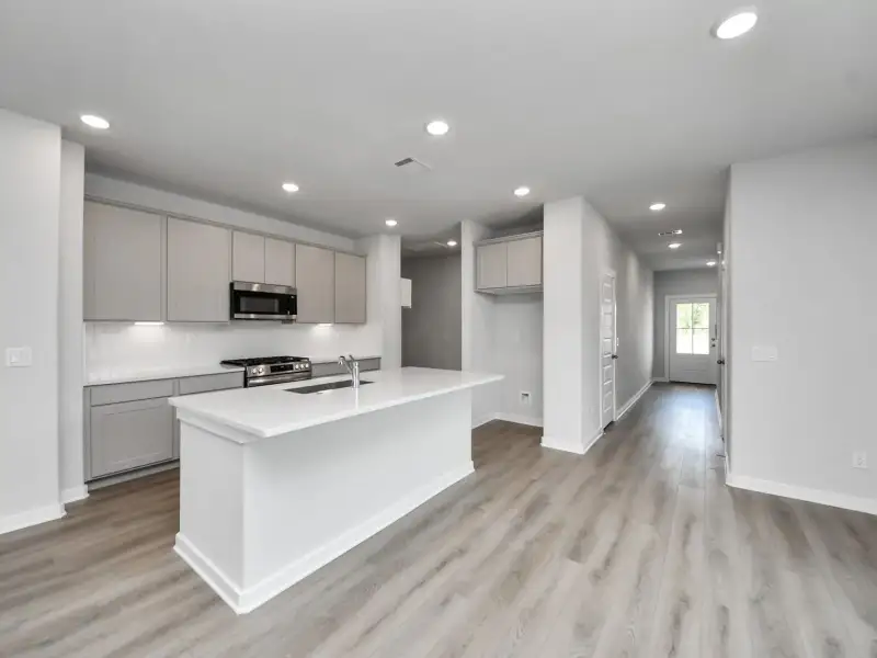 Furnished interior view inside a new home in Windmill Estates, Magnolia (Image 4).