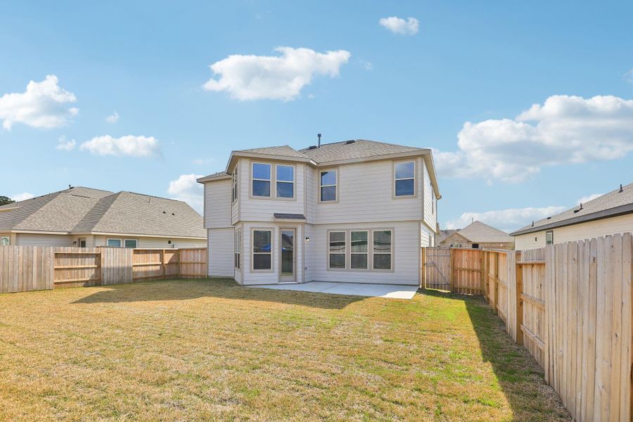 This private, fenced-in backyard offers an expansive outdoor retreat perfectly suited for both relaxation and active play. The generous lawn provides a versatile canvas for your landscaping vision, whether it's a vibrant garden or a dedicated play area.