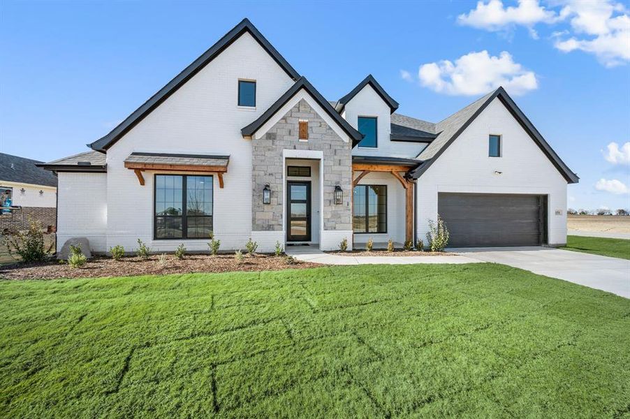 Front exterior of a new home in Settlers Glen, New Fairview, TX, highlighting curb appeal (Image 24). Front exterior of a new home in Settlers Glen, New Fairview, TX, highlighting curb appeal (Image 24).