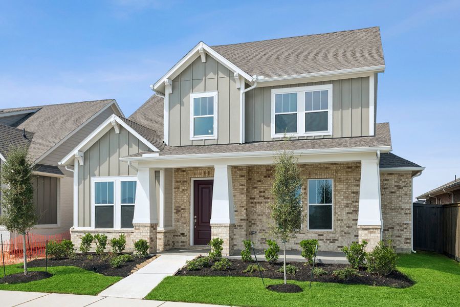 Front exterior of a new home in Riceland - Enclave Row Collection, Mont Belvieu, TX, highlighting curb appeal (Image 26).