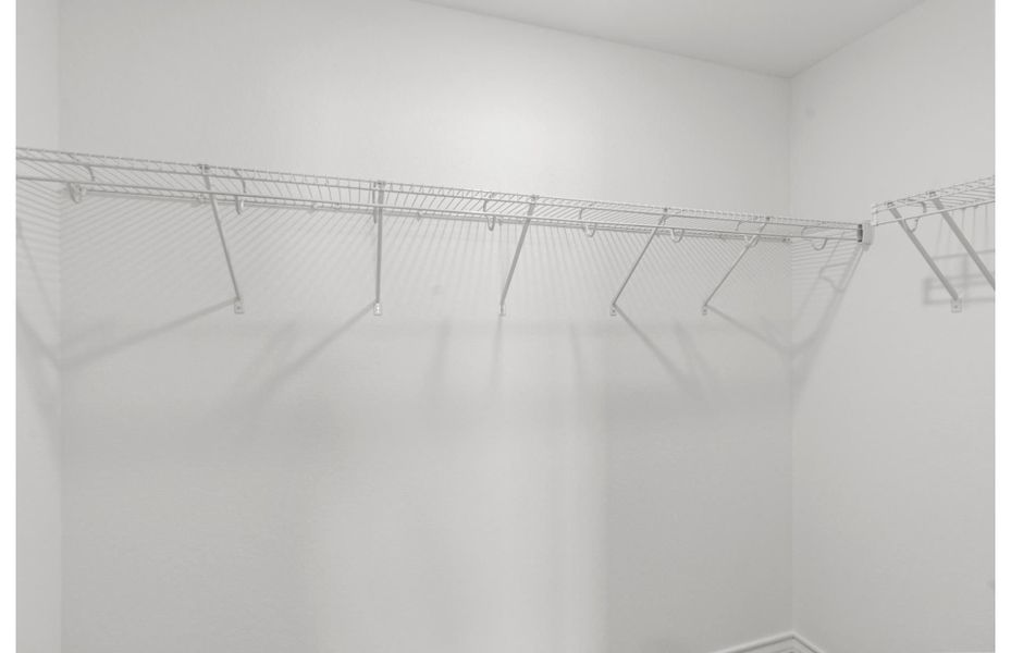 Primary Walk-In Closet Primary Walk-In Closet
