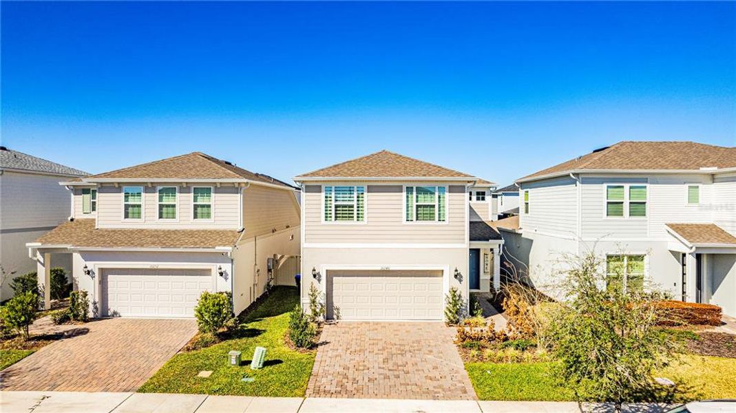 Front exterior of a new home in , Orlando, FL, highlighting curb appeal (Image 24). Front exterior of a new home in , Orlando, FL, highlighting curb appeal (Image 24).