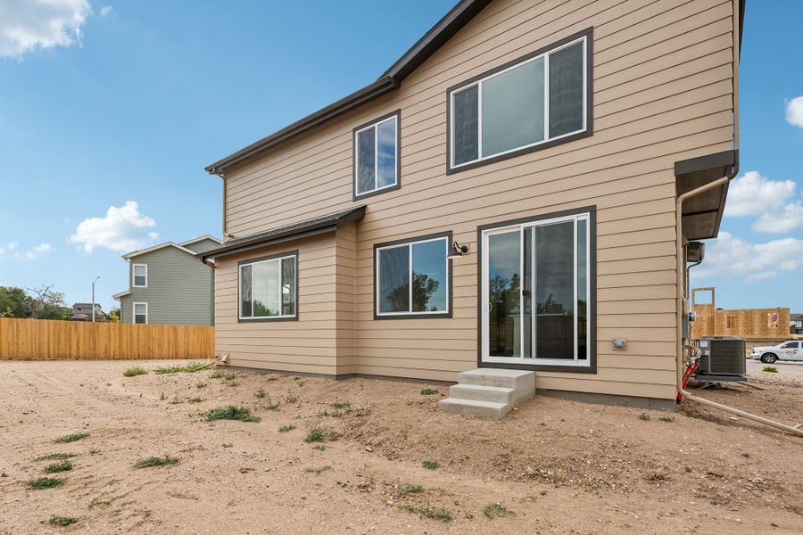 Exterior details and patio area of a home in Cherry Meadows, Brighton (Image 3).