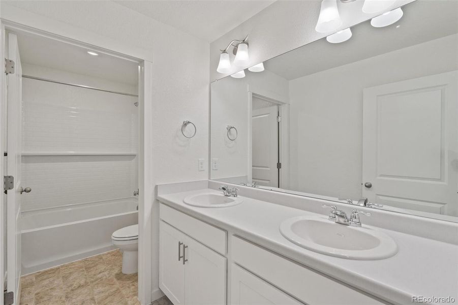 Furnished interior view inside a new home in Trails at Crowfoot, Parker (Image 8).