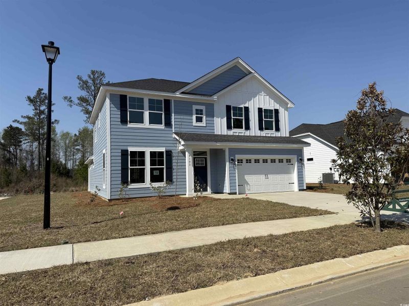 Front exterior of a new home in Westwood Reserve, Conway, SC, highlighting curb appeal (Image 1). Front exterior of a new home in Westwood Reserve, Conway, SC, highlighting curb appeal (Image 1).