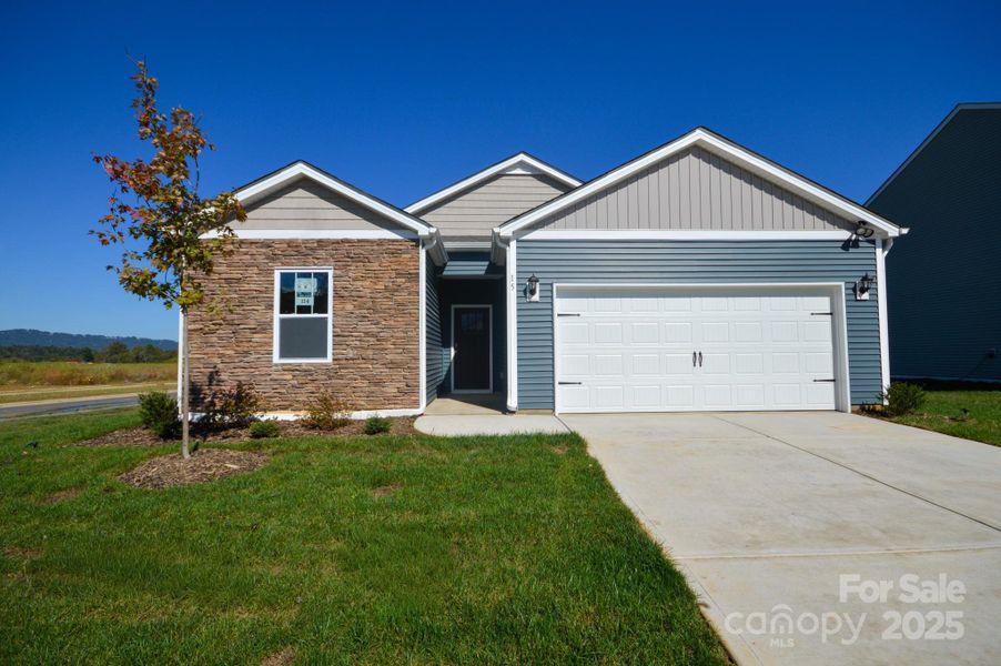 Front exterior of a new home in Tap Root Farms, Fletcher, NC, highlighting curb appeal (Image 2).