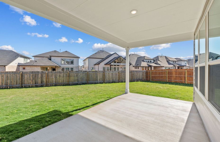 Exterior details and patio area of a home in Santa Rita Ranch, Liberty Hill (Image 30).