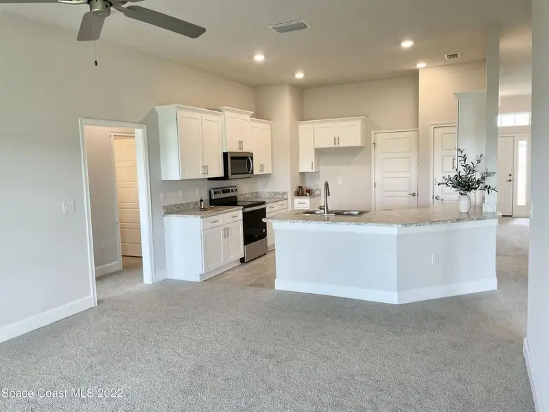 Representative furnished interior of a home built from the 1485 by Adams Homes in Winding Oaks, Weeki Wachee (Image 4). Representative furnished interior of a home built from the 1485 by Adams Homes in Winding Oaks, Weeki Wachee (Image 4).