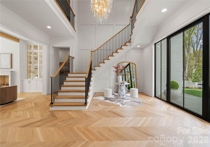 Two story foyer with motion light up stairs Two story foyer with motion light up stairs