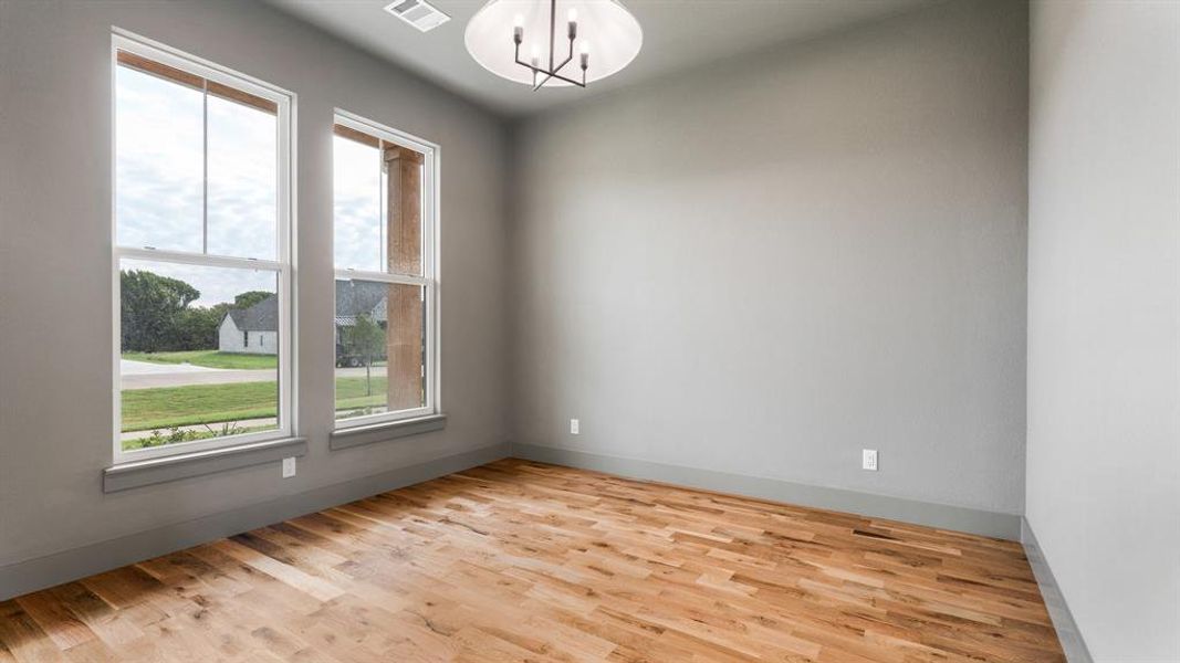 Spare room with light hardwood / wood-style flooring