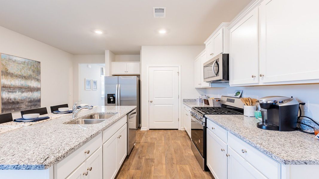 Furnished interior view inside a new home in Pine Hills at Cane Bay, Summerville (Image 7).