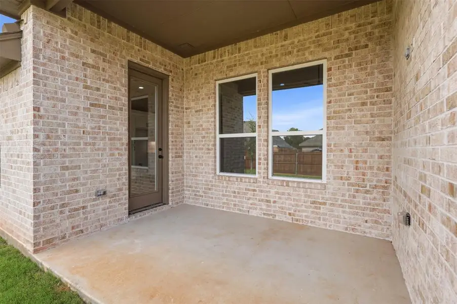 Exterior details and patio area of a home in , Springtown (Image 4).
