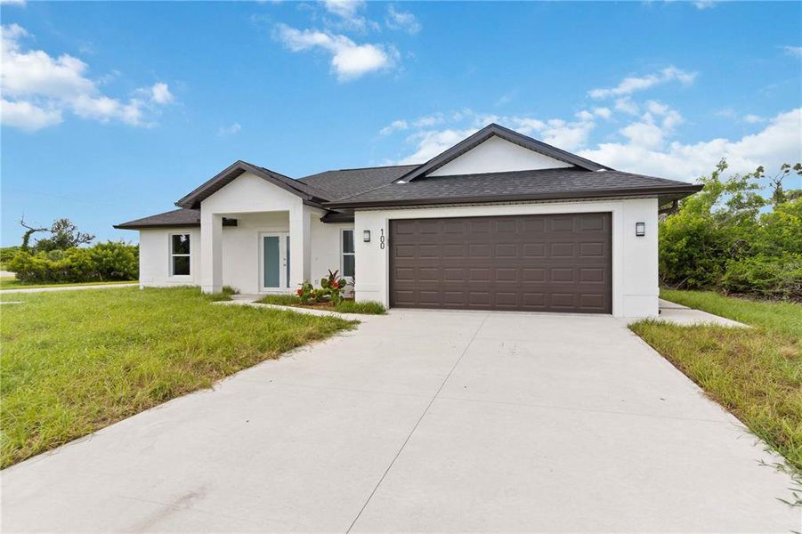 Front exterior of a new home in , Rotonda West, FL, highlighting curb appeal (Image 22).