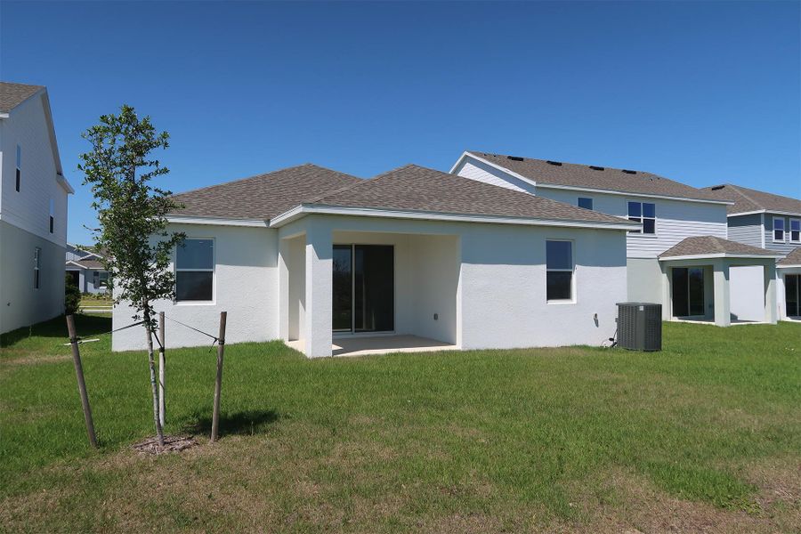 Front exterior of a new home in Ridgeview, Clermont, FL, highlighting curb appeal (Image 27).