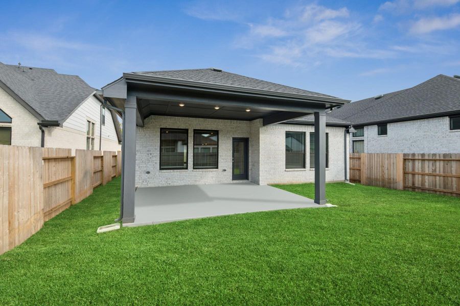 Exterior details and patio area of a home in Audubon 45' Homesites, Magnolia (Image 4).