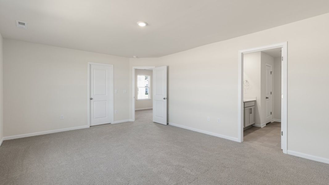 Spacious, unfurnished interior of a new home in The Grove at Matthews Landing, Fuquay Varina (Image 24).