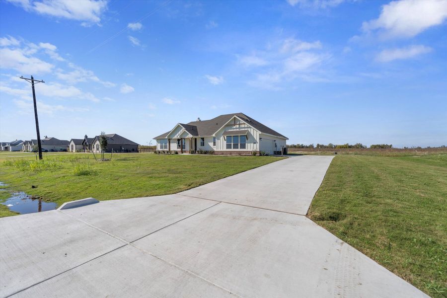 Front exterior of a new home in Clear Sky Addition, Valley View, TX, highlighting curb appeal (Image 22). Front exterior of a new home in Clear Sky Addition, Valley View, TX, highlighting curb appeal (Image 22).