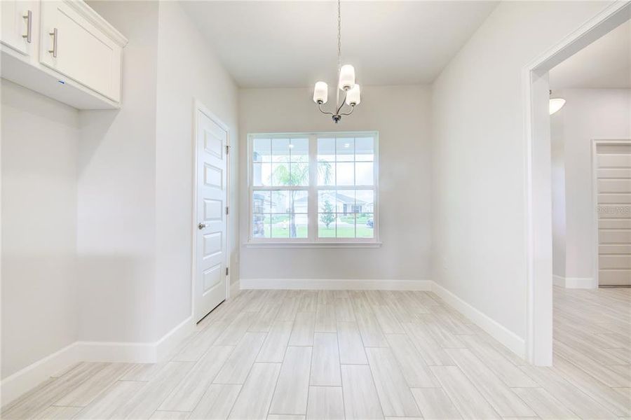 Spacious, unfurnished interior of a new home in Aviary at Rutland Ranch, Parrish (Image 22).