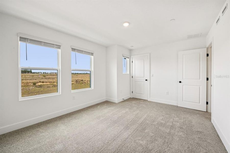 Spacious, unfurnished interior of a new home in Parkview at Hamlin, Winter Garden (Image 42).