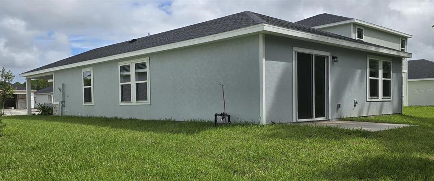 Exterior details and patio area of a home in Flagler Village - Classic Series, Palm Coast (Image 3).