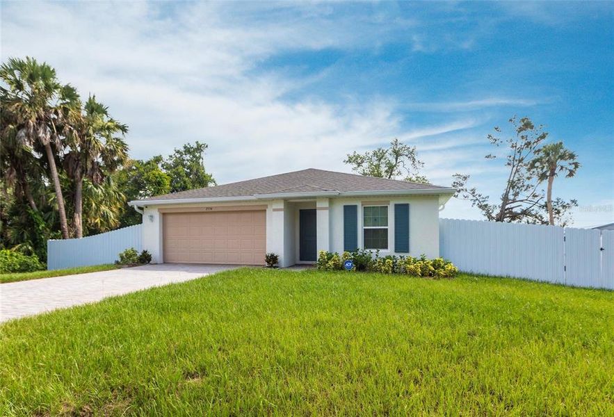 Front exterior of a new home in , Port Charlotte, FL, highlighting curb appeal (Image 23).