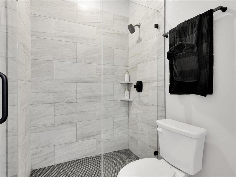 Bathroom with walk in shower and toilet