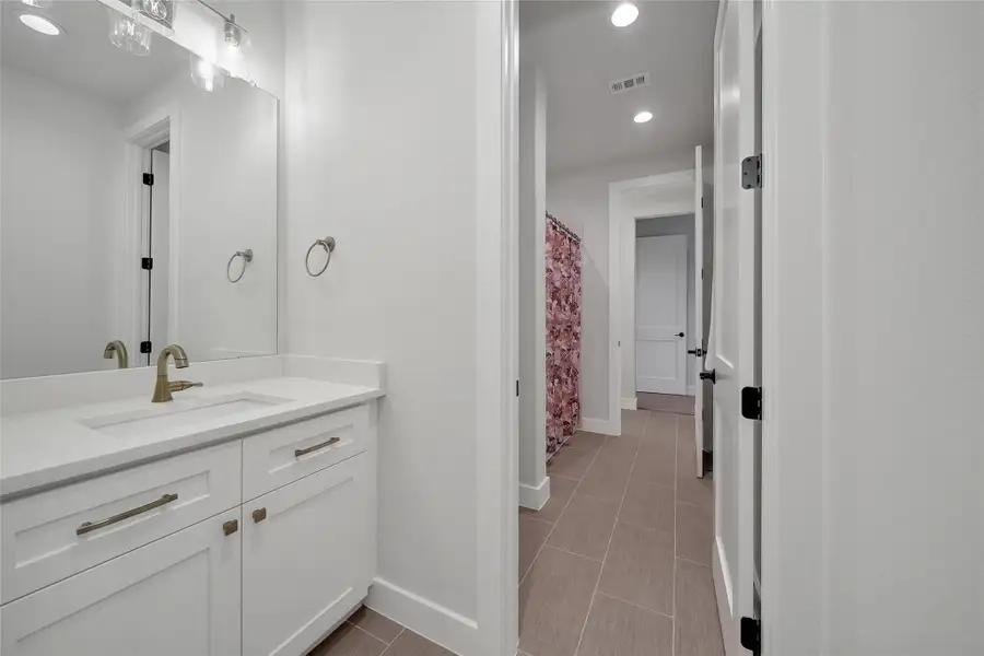 Furnished interior view inside a new home in ARTAVIA, Conroe (Image 17).