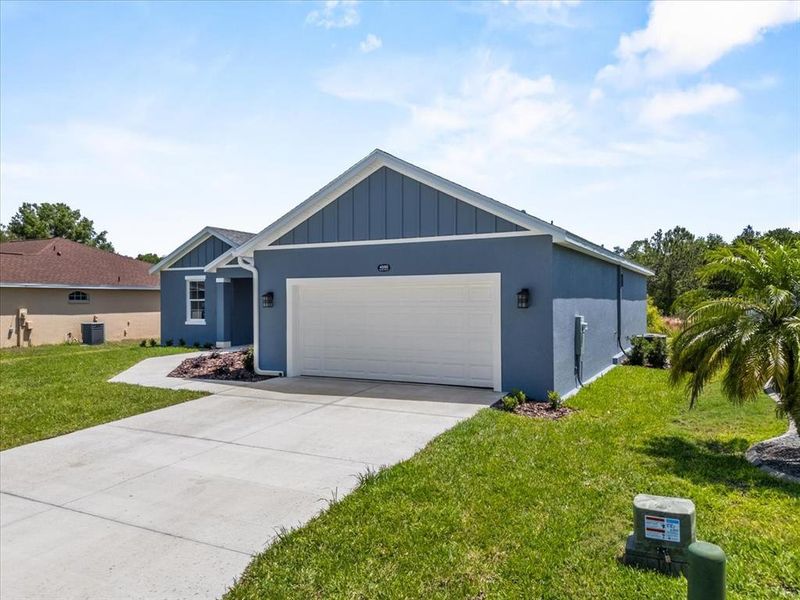 Front exterior of a new home in , Mulberry, FL, highlighting curb appeal (Image 21).