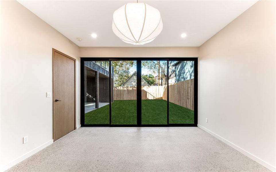 Unfurnished room featuring speckled floor