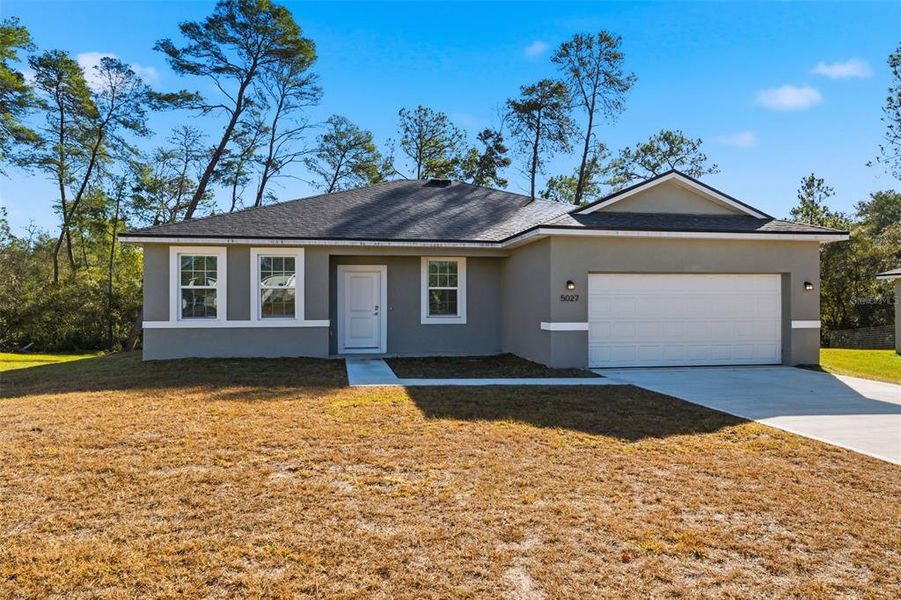 Front exterior of a new home in , Ocala, FL, highlighting curb appeal (Image 21).