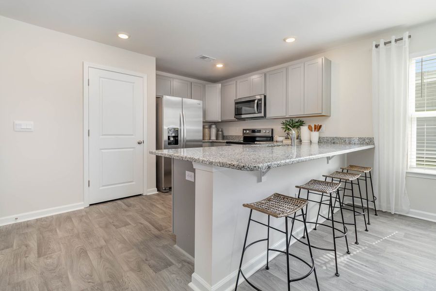 Representative furnished interior of a home built from the HELENA by D.R. Horton in Jordanville Farms, Galivants Ferry (Image 6).
