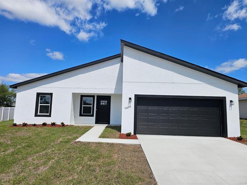 Front exterior of a new home in , Ocala, FL, highlighting curb appeal (Image 18). Front exterior of a new home in , Ocala, FL, highlighting curb appeal (Image 18).