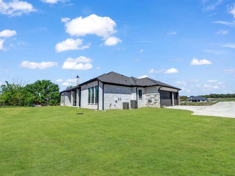 Front exterior of a new home in , Weatherford, TX, highlighting curb appeal (Image 2). Front exterior of a new home in , Weatherford, TX, highlighting curb appeal (Image 2).