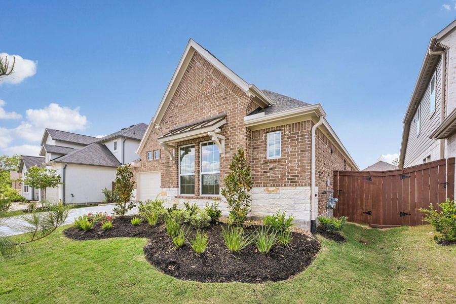 Front exterior of a new home in Evergreen 55', Conroe, TX, highlighting curb appeal (Image 28).