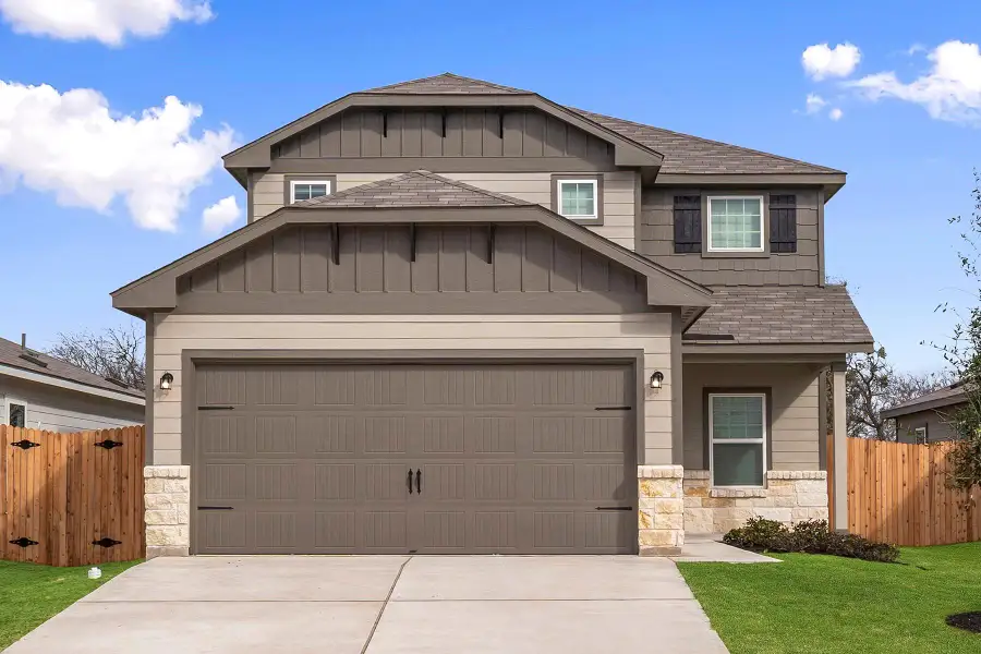 Front exterior of a new home in , Elgin, TX, highlighting curb appeal (Image 1). Front exterior of a new home in , Elgin, TX, highlighting curb appeal (Image 1).