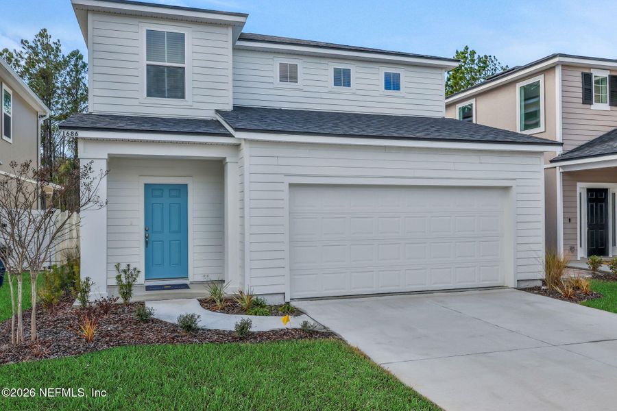 Front exterior of a new home in Cedar Creek, Jacksonville, FL, highlighting curb appeal (Image 25).