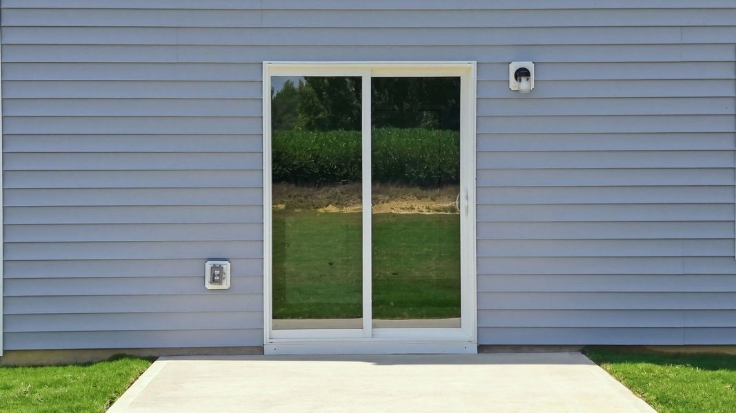 Exterior details and patio area of a home in Hobbs Farm, Ayden (Image 24).