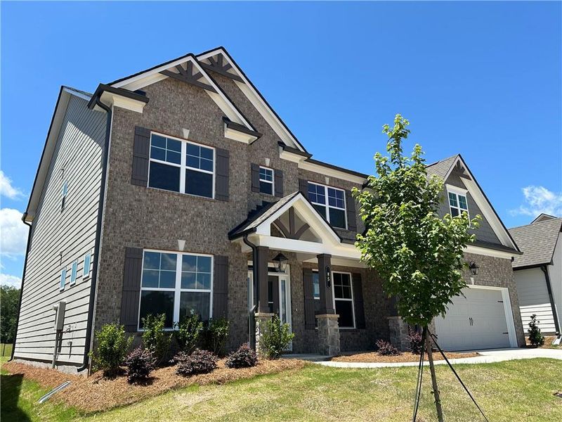 Front exterior of a new home in Summerlin, Winder, GA, highlighting curb appeal (Image 32).