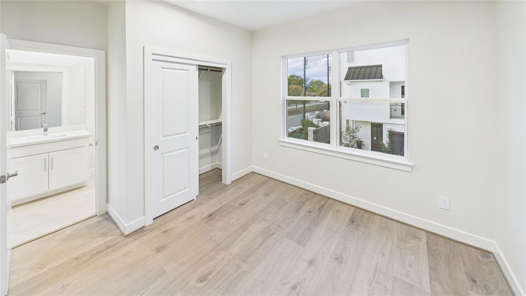 Secondary bedroom filled with beautiful natural light.