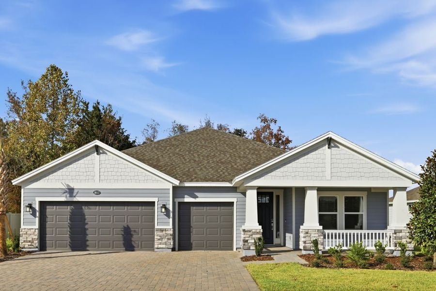 Front exterior of a new home in Headwaters at Lofton Creek, Yulee, FL, highlighting curb appeal (Image 1).