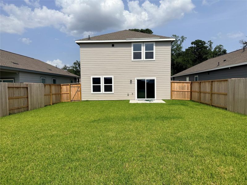 Exterior details and patio area of a home in The Landing, New Caney (Image 2). Exterior details and patio area of a home in The Landing, New Caney (Image 2).