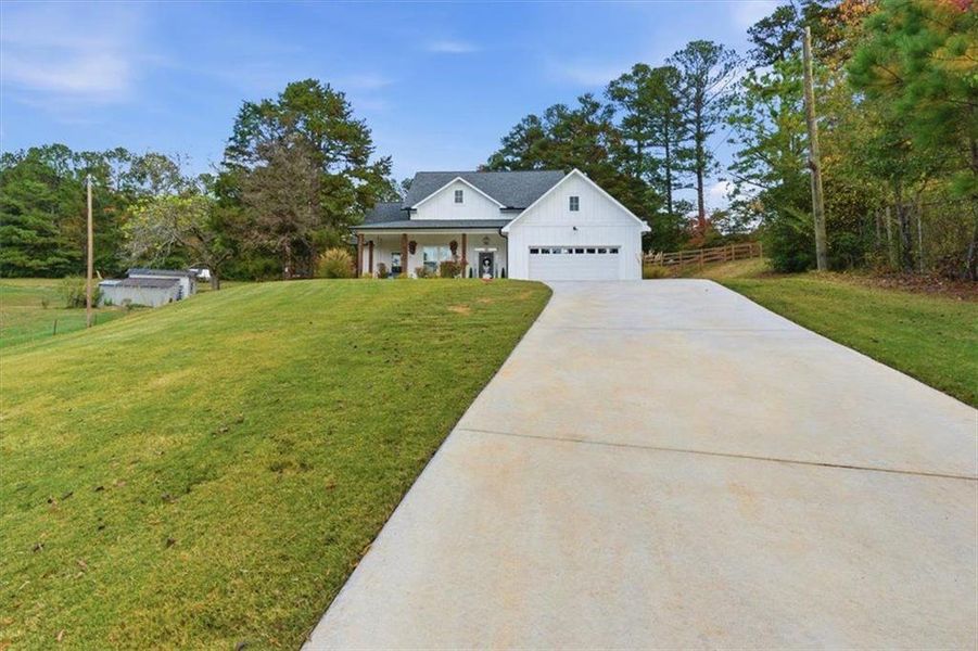 Front exterior of a new home in , Calhoun, GA, highlighting curb appeal (Image 2).