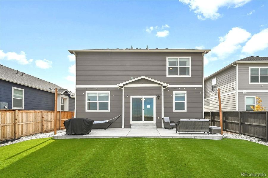 Exterior details and patio area of a home in Settlers Crossing, Commerce City (Image 19).