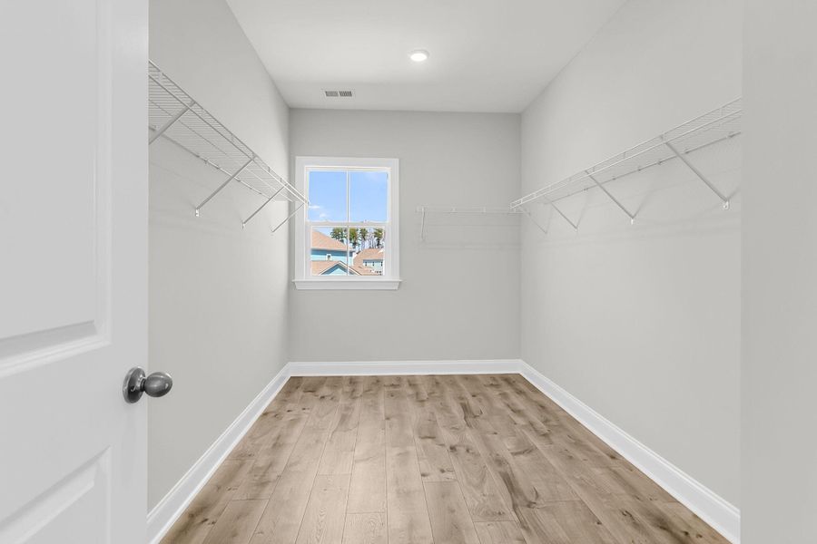 Spacious, unfurnished interior of a new home in Tidewater at Lakes of Cane Bay, Summerville (Image 28).