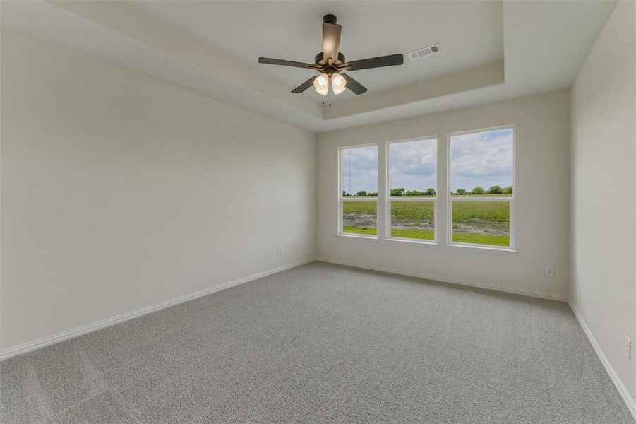 Room featuring light gray carpet, white baseboards, and white walls Room featuring light gray carpet, white baseboards, and white walls