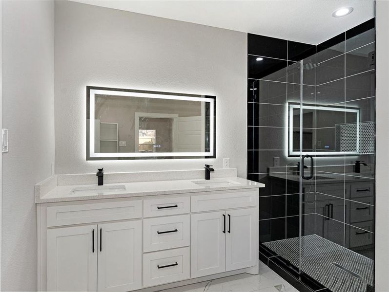 Bathroom featuring vanity and walk in shower