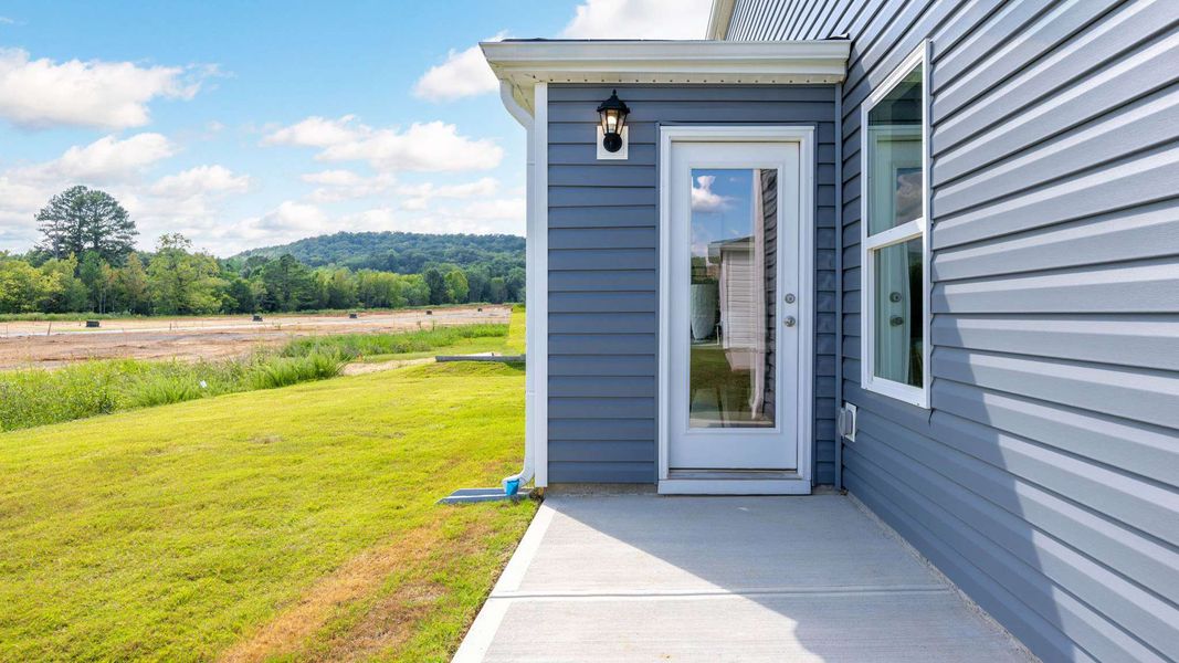 Front exterior of a new home in Hawk's Ridge, Rossville, GA, highlighting curb appeal (Image 21).